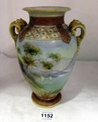 A Noritake vase decorated with mountain scene