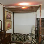 A mahogany four poster bed frame