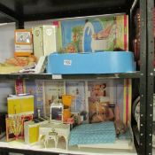 A Sindy house, swimming pool, furniture etc (2shelves)