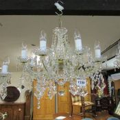 An 8 light glass chandelier