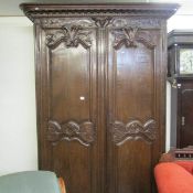 A large Carved French armoire