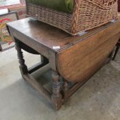 A large 18th century carved oak gate leg table