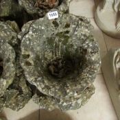 A Haddon stone shell garden urn
