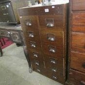 An 8 drawer oak filing cabinet from a bank