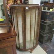 A bow front china cabinet