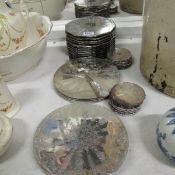 A quantity of silver plated coasters etc