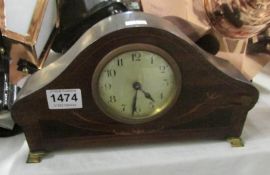 An inlaid mantel clock