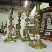 A set of 4 Victorian brass candlesticks