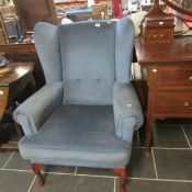 A blue wing armchair