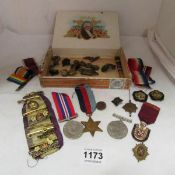 A box of medals and badges including Military and Primrose League