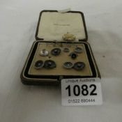 A case of dress studs and a pinchbeck pendant