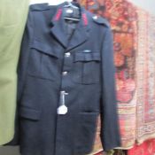 A uniform jacket with 53HMC cloth badges on lapels