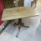 A period oak tripod table