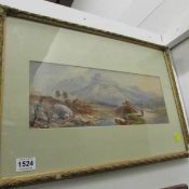 A gilt framed watercolour mountain scene