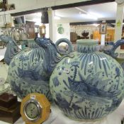 2 large blue and white teapots