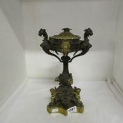 A brass and bronze lamp base surmounted with cherubs and dragons
