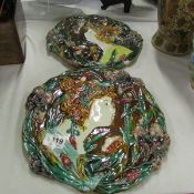 A pair of Majolica wall plaques