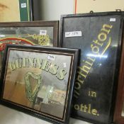A Guinness advertising mirror and a Worthington sign