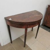 A mahogany D end fold over table