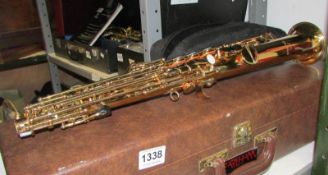 A cased Earlham Super brass Soprano Saxaphone