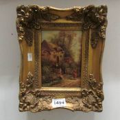 A small gilt framed picture of a country scene