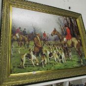 A large gilt framed print of a hunting scene