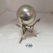 A silver ladies bowling trophy on stand