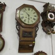 A mahogany inlaid wall clock