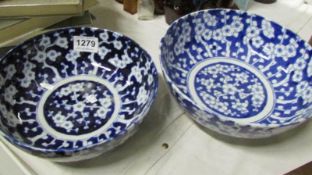 A pair of blue and white Oriental bowls