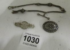 A silver Albertine watch chain and 2 silver brooches (20g)