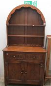 A small oak arched top dresser