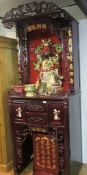 An ornate lacquered Chinese cabinets and ornaments