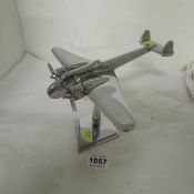 A chrome model of a bomber plane