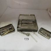 A tin of old medical equipment