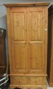 A 2 door pine wardrobe