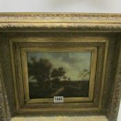 A gilt framed country scene picture