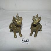 A pair of brass Dogs of Foo