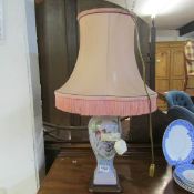 A pottery table lamp with shade