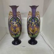A pair of hand painted vases (one a/f)