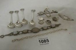 A mixed lot of silver items including bracelet, 4 spoons etc