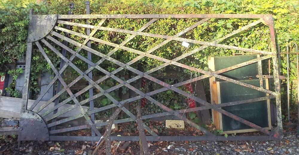 19th. C. wrought iron railway gate with sunburst design. { 152cm H X 305cm W }.
