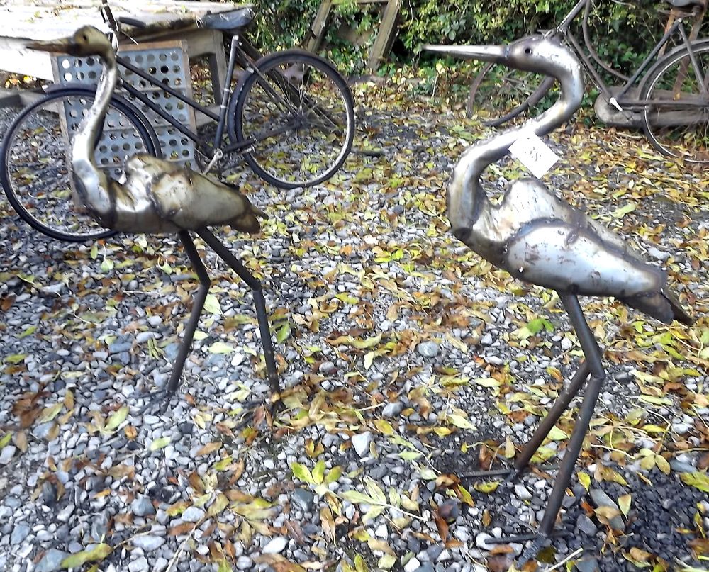 Pair of metal cranes.