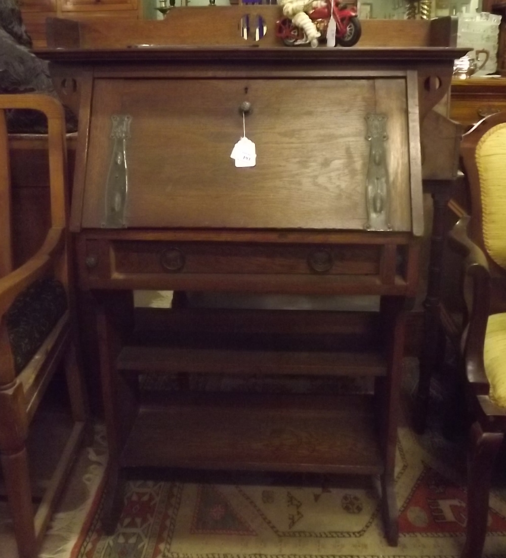Art Nouveau oak desk with fall front decorated with copper straps in the Arts and Crafts style.