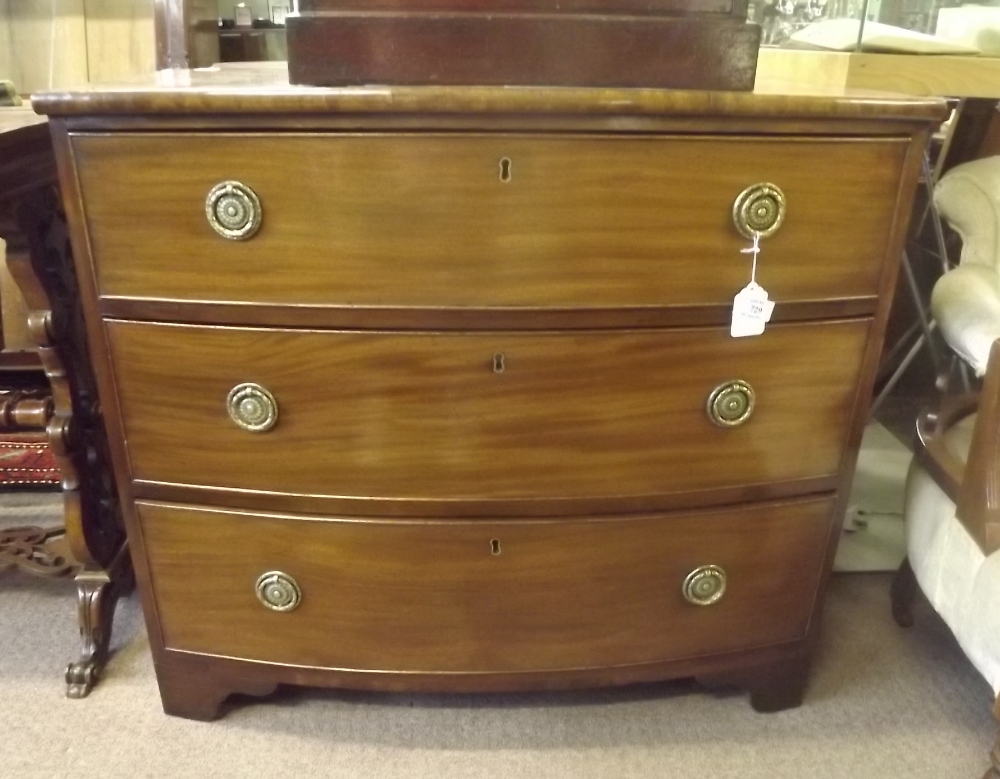 Georgian mahogany bow fronted chest with three graduating long drawer on bracket feet. { 80cm H X