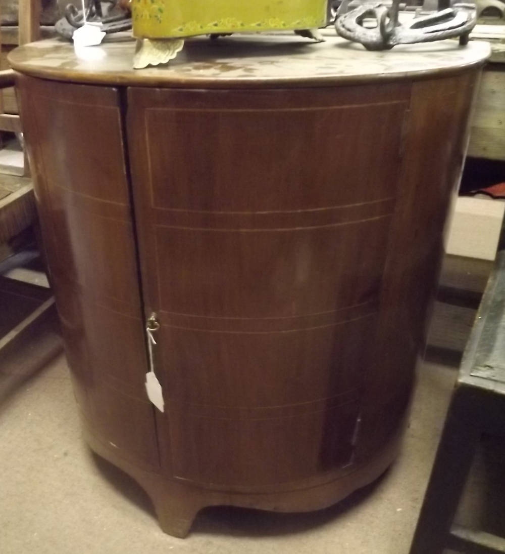 Edwardian inlaid  mahogany demi - lune cabinet .