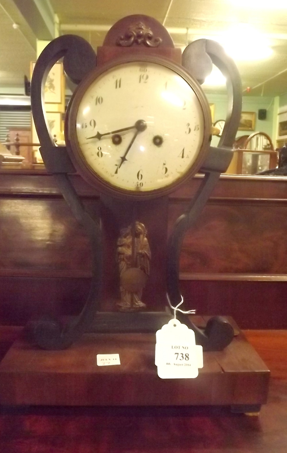 Regency mahogany and ebony drum head mantle clock.