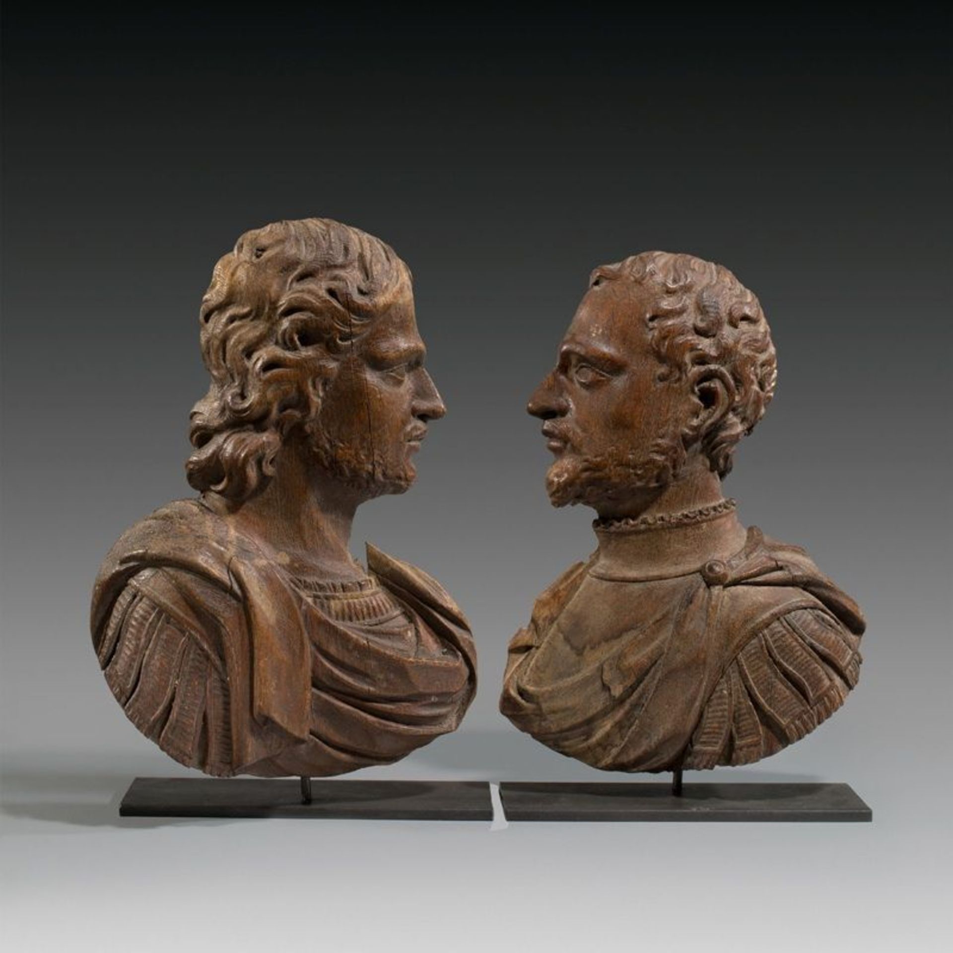 Dutch ()  TWO ROYAL BUSTS IN ANTIQUE ARMOUR. Circa 1700  Oak, carved.  47 x 32; 45 x 31 cm (with