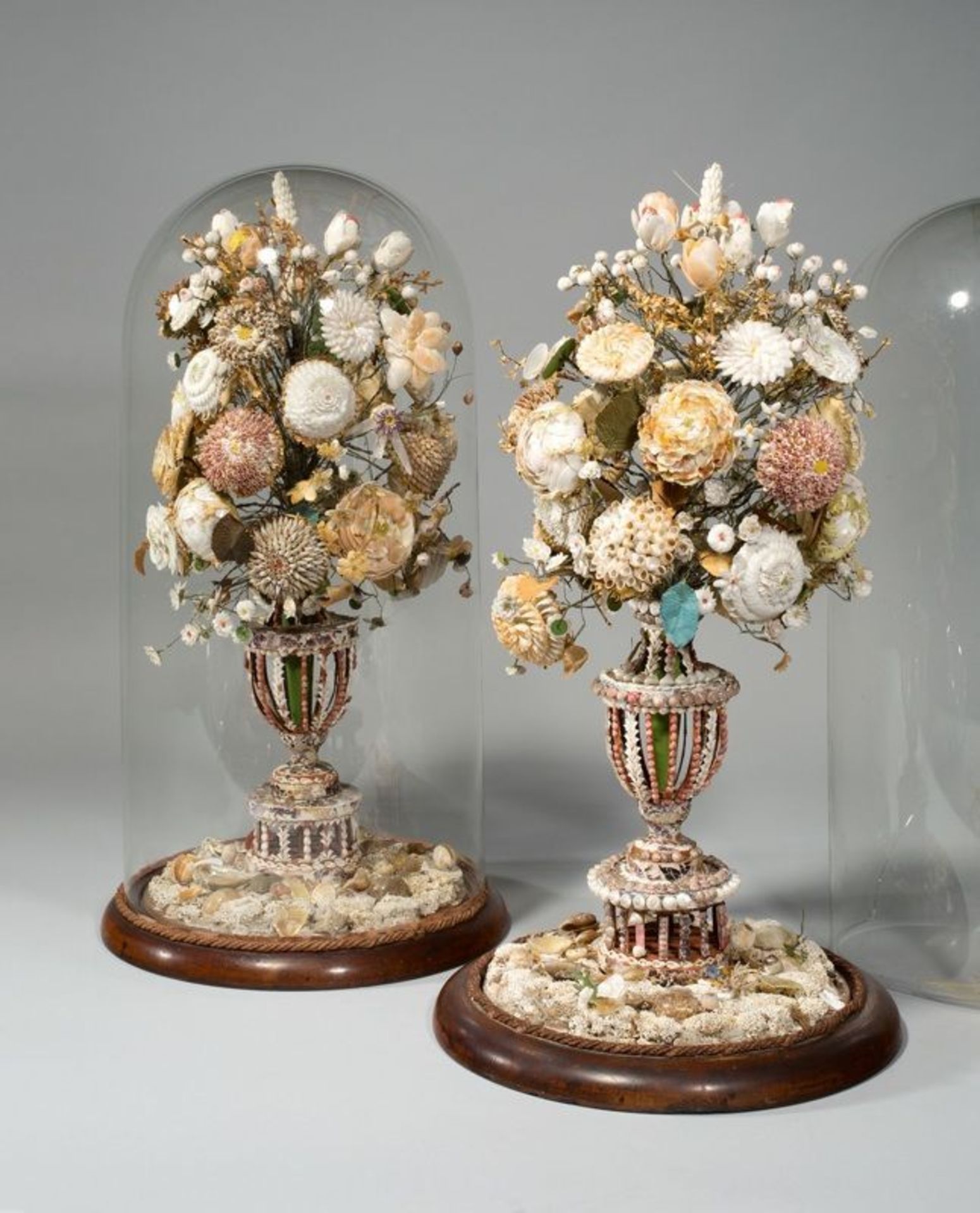 England ()  TWO SHELLWORK BOUQUETS. Circa 1800  Shells; wire; silk; paper; wood base, bell jars.  54