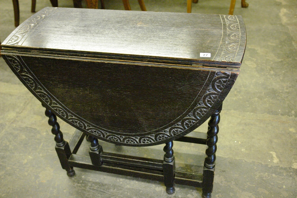 20TH CENTURY EBONIZED CARVED OAK CAROLEON STYLE DROPFLAP BARELY TWIST TABLE 82 X 74 X 35CM