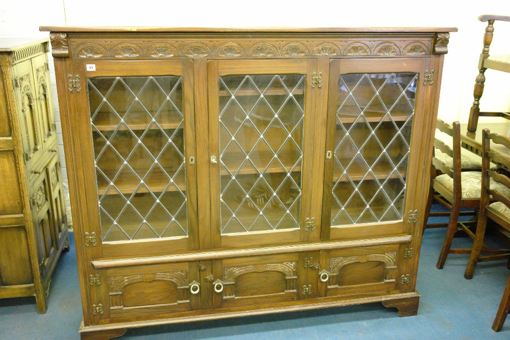 OAK REPRODUCTION THREE DOOR LEAD GLAZED CABINET WITH LUNETTE CARVED FRIEZE 162 X 14 X 34CM